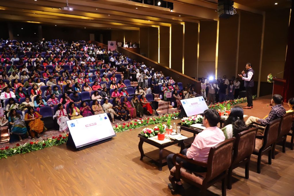 Industry Minister Col. Rajyavardhan Rathore interacting warmly with small business owners and MSME delegates at an economic summit.
