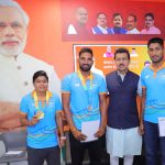 Col. Rajyavardhan Rathore interacting with young athletes and providing sports kits.