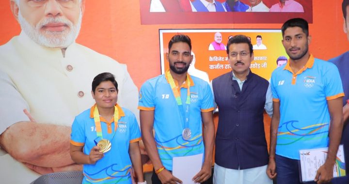 Col. Rajyavardhan Rathore interacting with young athletes and providing sports kits.