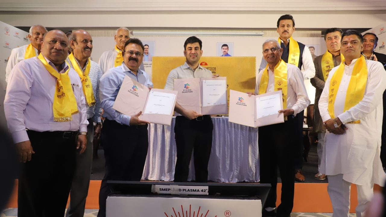International buyers and local MSME entrepreneurs discussing stone cutting technology deals at the India Stone Mart pavilion in JECC, Jaipur.