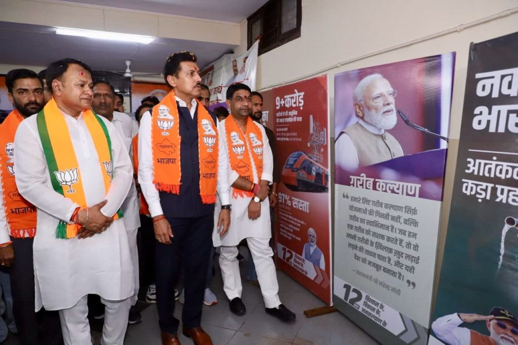 Cabinet Minister Col. Rajyavardhan Singh Rathore inaugurating an exhibition on national development and public welfare achievements in Jaipur.