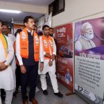 Cabinet Minister Col. Rajyavardhan Singh Rathore inaugurating an exhibition on national development and public welfare achievements in Jaipur.