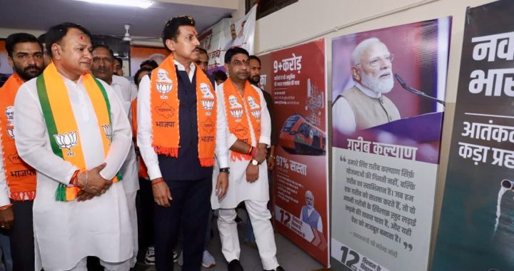 Cabinet Minister Col. Rajyavardhan Singh Rathore inaugurating an exhibition on national development and public welfare achievements in Jaipur.